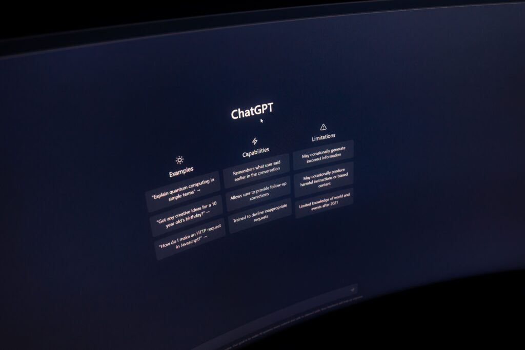 A computer screen displays the ChatGPT interface, with examples, capabilities, and limitations in white text against a dark background—mirroring how BCL Search helps AI companies build administrative teams to support intelligent solutions.